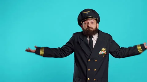 Clueless flying pilot doing i dont know gesture Stock Footage 233644397