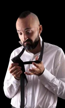 Clueless hispanic man dressing up in need of assistance Stock Photos