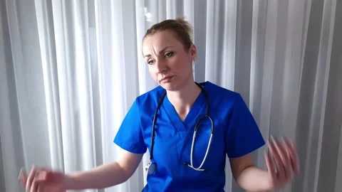 Clueless upset helpless resigned young female doctor has no answer Stock Footage 233111664