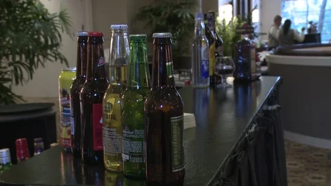 A Cluster of Alcoholic Drinks Sitting on Bar 스톡 동영상 222511740