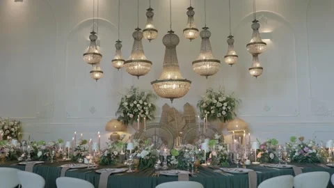 Cluster of Beaded Chandeliers Above Long Wedding Banquet Table with Flowers 動画素材 343985965