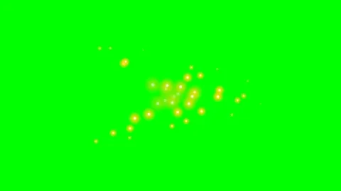 A cluster of glowing yellow light particles floating on a vibrant green scree Stock Footage 340263307