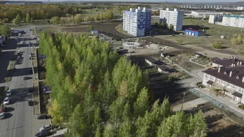 Cluster of high-rise structures with expressway and lush garden Stock Footage 271327053