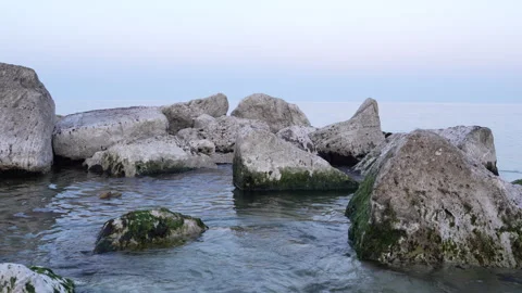 Cluster of large white breakwater rocks in calm Adriatic Sea Porto Recanati 스톡 동영상 336758239