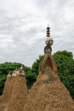 A cluster of mud pinnacles topped with ceramic caps and a crescent finial f.. Stock Photos
