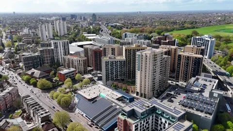 Cluster of new apartment blocks and rooftop solar arrays fills a regenerated 動画素材 343469882
