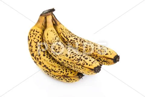 Cluster of over ripe bananas isolated on white background Stock Photos