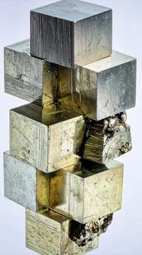 A cluster of pyrite cubes with metallic luster and geometric formations Stock Photos