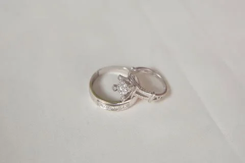 Cluster stack of diamond wedding engagement rings isolated on white . Beautif Stock Photos