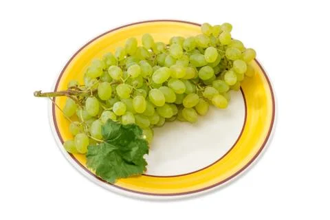 Cluster of the table white grapes on dish Stock Photos