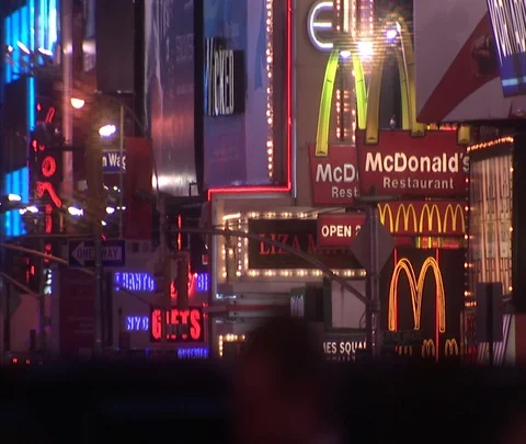 Cluster of Times Square lighted signs for McDonald's and other businesses Video stock 86748990