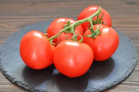 Cluster of tomatoes Stock Photos