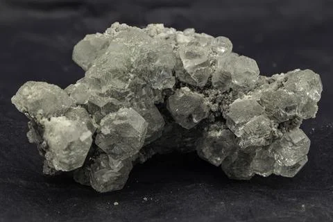 Cluster of translucent grey celestine crystals with natural rough matrix Stock Photos