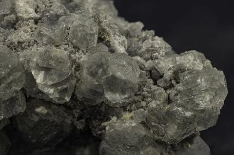 Cluster of translucent grey celestine crystals with natural rough matrix Foto stock