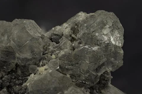 Cluster of translucent grey celestine crystals with natural rough matrix Foto stock