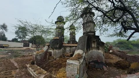 Cluster of Weathered Cylindrical Structure , Likely Historical Village Well Stock Photos