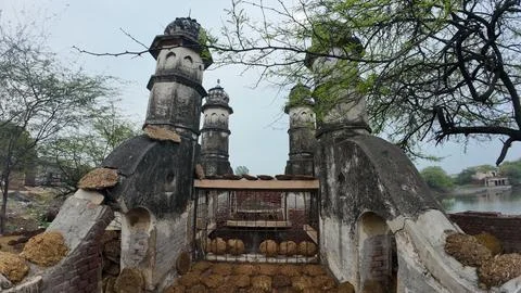 Cluster of Weathered Cylindrical Structure , Likely Historical Village Well 库存照片