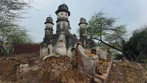 Cluster of Weathered Cylindrical Structure , Likely Historical Village Well 库存照片