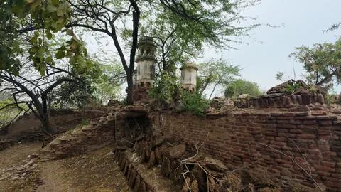 Cluster of Weathered Cylindrical Structure , Likely Historical Village Well 库存照片