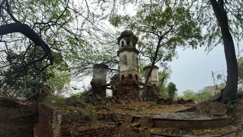 Cluster of Weathered Cylindrical Structure , Likely Historical Village Well 库存照片