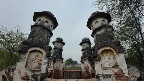 Cluster of Weathered Cylindrical Structure , Likely Historical Village Well 库存照片