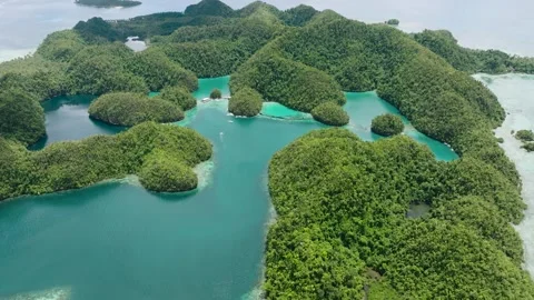 Clusters of green islets with lagoons and clear waters. Sugba Blue Lagoon Stock Footage 337445764