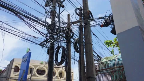 Cluttered and Messy Electrical Cables on Electric  Poles. Video stock 139807308