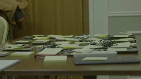 Cluttered Table with Smartphones and Sticky Notes 動画素材 341904322