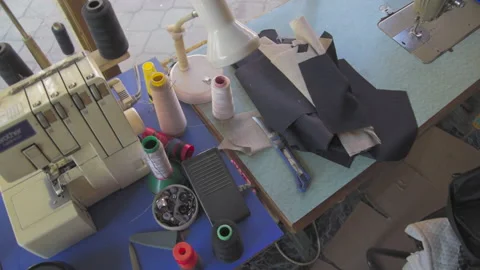 Cluttered tailors desk by the window Video stock 147547049