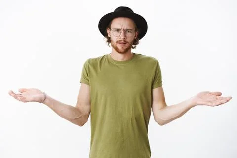 Cmon what wrong. Portrait of pissed, angry and confused bearded guy in glasses Stock Photos