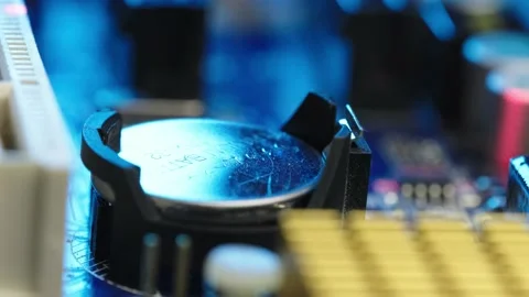 Cmos backup battery powering bios, lithium button cell component inside Stock Footage 169956146