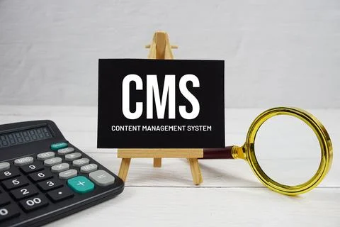 CMS abbreviation of Content Management System text with magnifying glass an.. Stock Photos