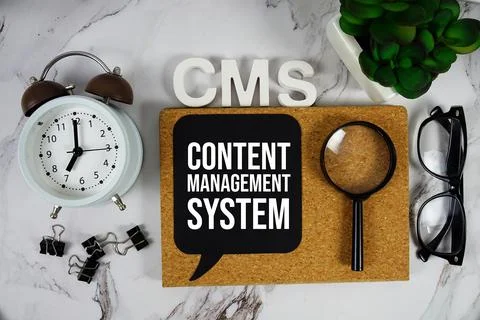 CMS - Content Management System acronym with alarm clock and magnifying gla.. Stock Photos