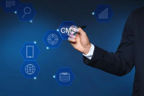 CMS. Man using virtual screen, closeup. Scheme with icons on blue background Foto stock