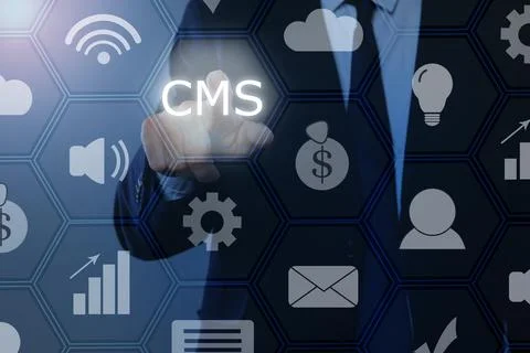 CMS. Man using virtual screen, closeup. Scheme with icons on blue background Foto stock