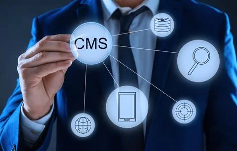 CMS. Man using virtual screen, closeup. Scheme with icons on dark background Foto stock