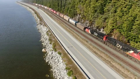 CN Rail Grain Train heading east along the Skeena River 4K footage Stock Footage 149148165
