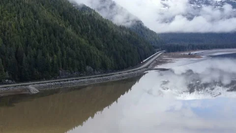 Cn Rail train slow drone pan along the Skeena River 4K footage Stock Footage 149379786