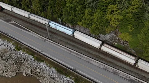 CN Rail Westbound pellet train diverging into siding 4K drone Stock Footage 149380128