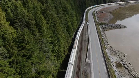 CN Rail Westbound Train entering a siding 4K drone Stock Footage 149380178