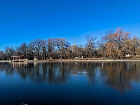 CN Tower and Winter Trees Reflected in Frozen Toronto Island Lagoon 스톡 사진