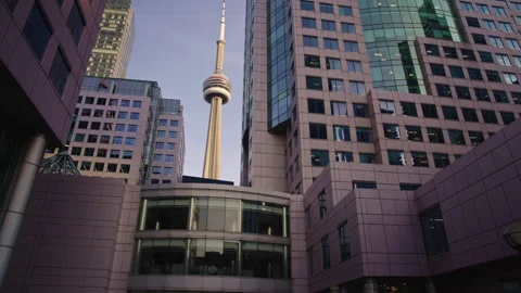 CN Tower Framed by Downtown Toronto Office Buildings During Slow Gimbal Orbit Vídeo Stock 337740120