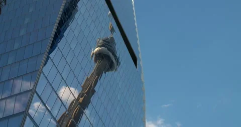 CN Tower reflected in glass windows of Toronto high-rise building. Modern Stock Footage 277930191