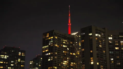CN Tower Revealed Behind Downtown Toronto Buildings at Night Vídeo Stock 337739944