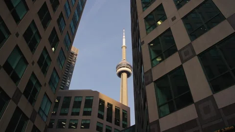 CN Tower Revealed Between Downtown Buildings During Slow Motion Camera Move Vídeo Stock 338165220