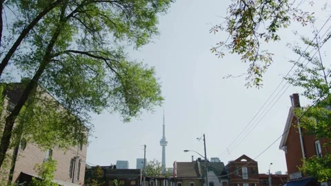 CN Tower Seen Through Trees in a Toronto Residential Neighbourhood Stock Footage 328370681