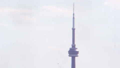 CN Tower Sky High Tip in Blue Sky Background. Nostalgic Toronto in 1970s Stock Footage 239021184