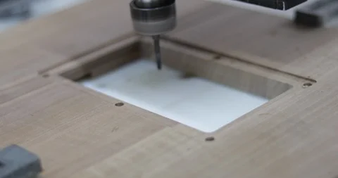 CNC (computer numerical control) machine cutting custom-designed shape on board Stock Footage 105687630