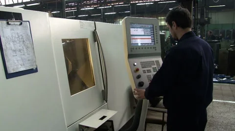 CNC. Computer numerical control. Worker control cnc machine and set the function Stock Footage 49026635