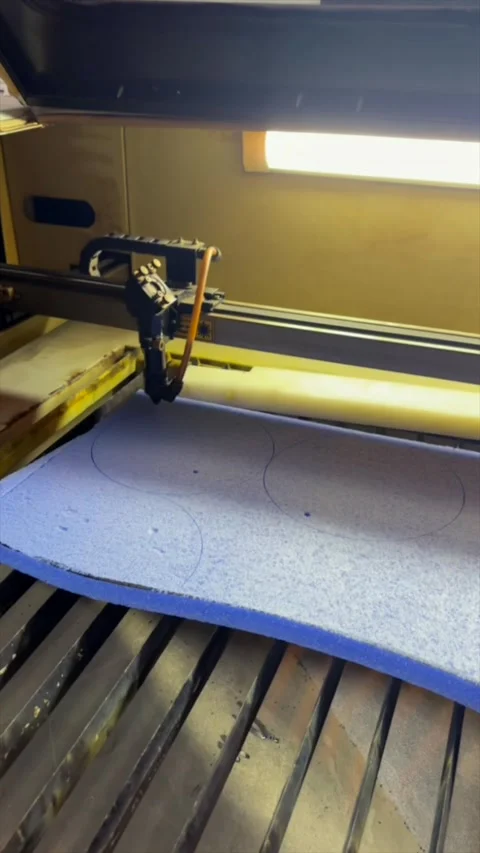 CNC cutting machine shaping foam sheet in workshop Stock Footage 329862624